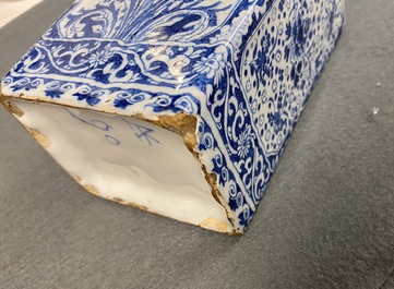 A rectangular Dutch Delft blue and white tea caddy with floral design, late 17th C.